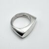 handcrafted minimalist silver geometric ring on white background