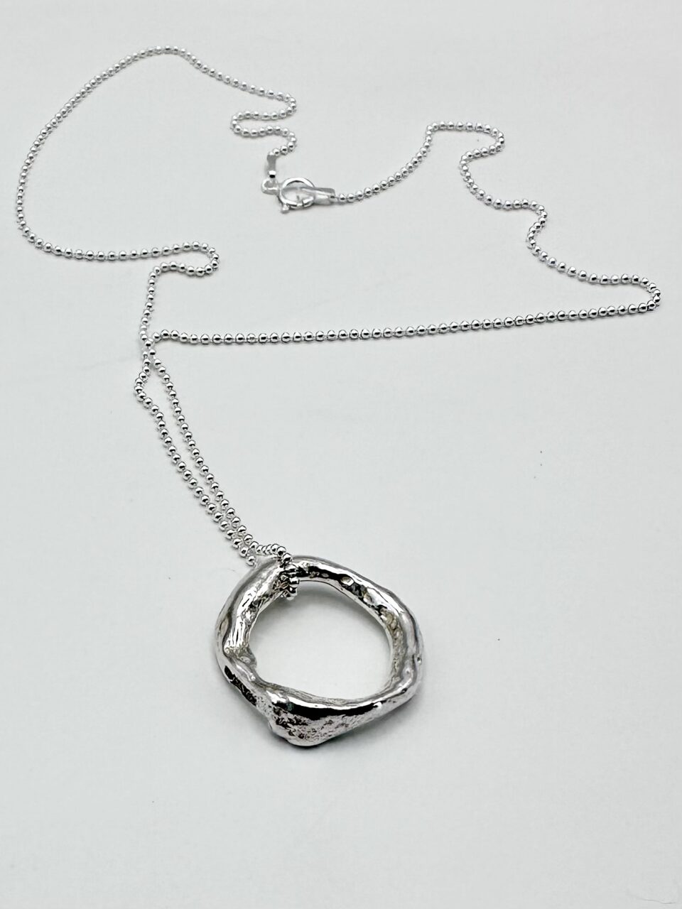 handcrafted sterling silver spiral pendant necklace on fine chain – melted silver, hallmarked, artisan jewellery