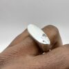 handmade sterling silver raw edge signet ring with molten textured surface