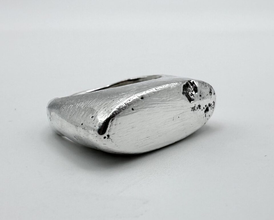 handmade sterling silver raw edge signet ring with molten textured surface