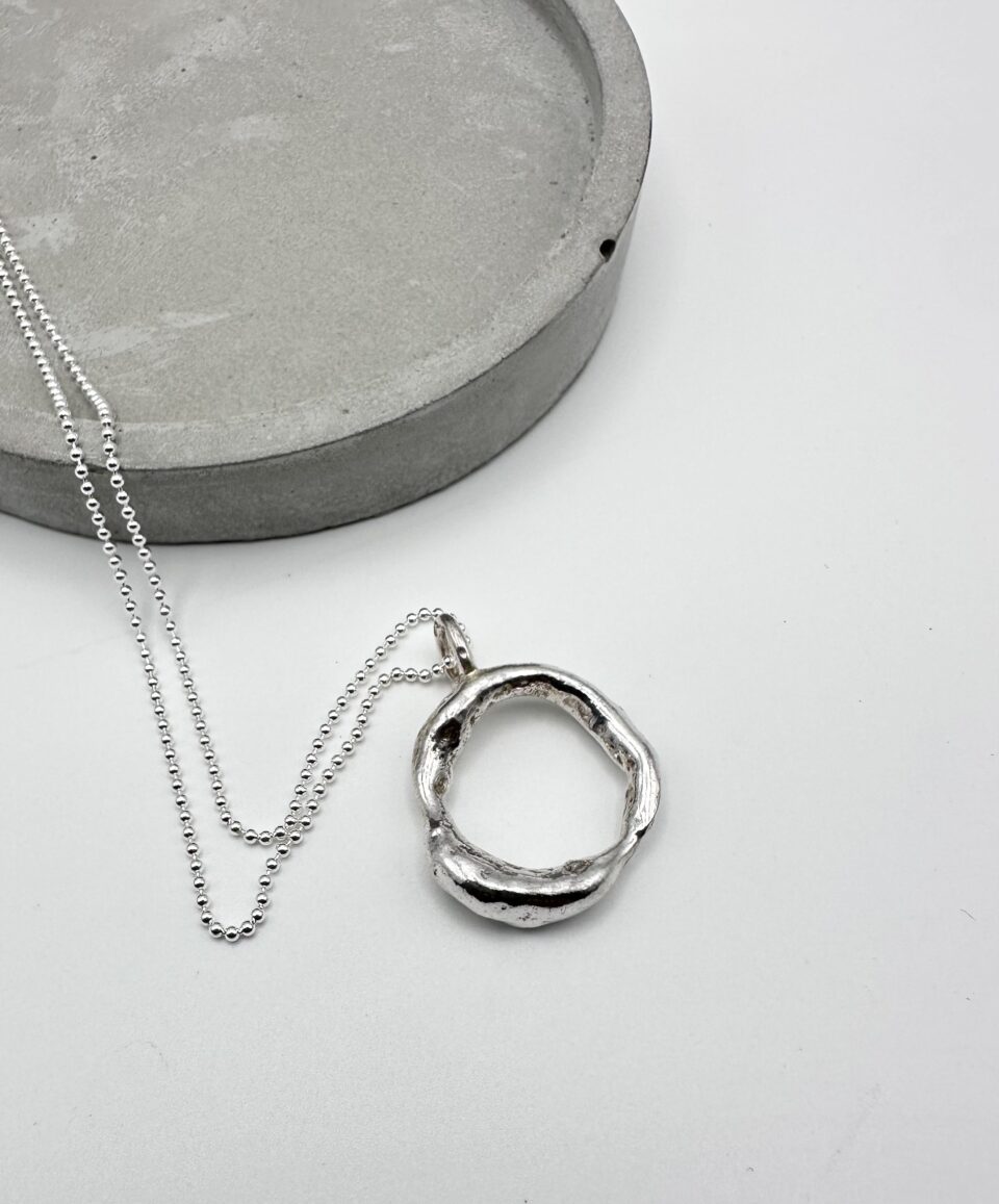 handcrafted organic silver circle pendant necklace on silver chain