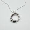handcrafted organic silver circle pendant necklace on silver chain