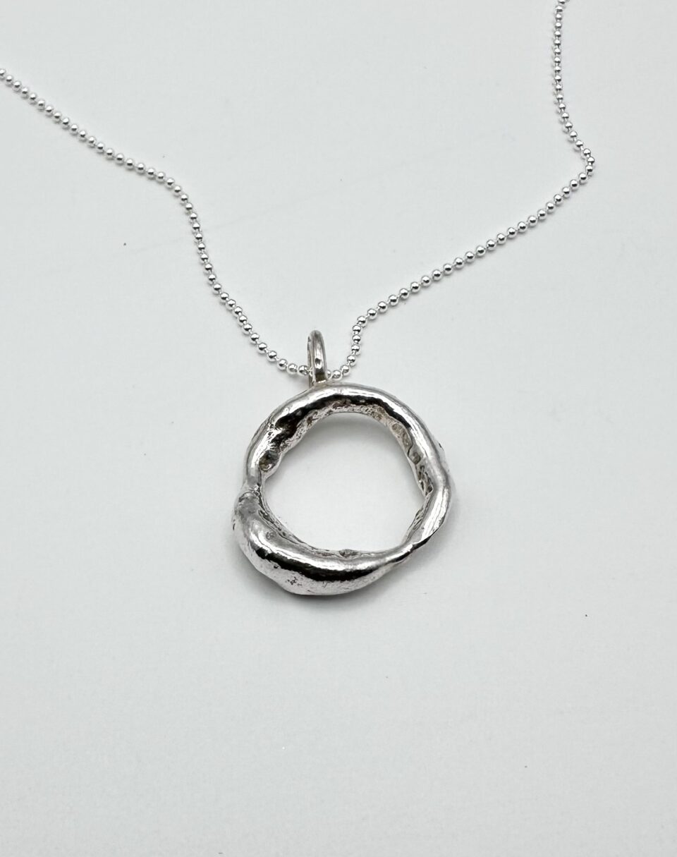 handcrafted organic silver circle pendant necklace on silver chain