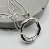 handcrafted organic silver circle pendant necklace on silver chain