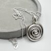 handmade spiral silver pendant necklace melted silver organic texture”