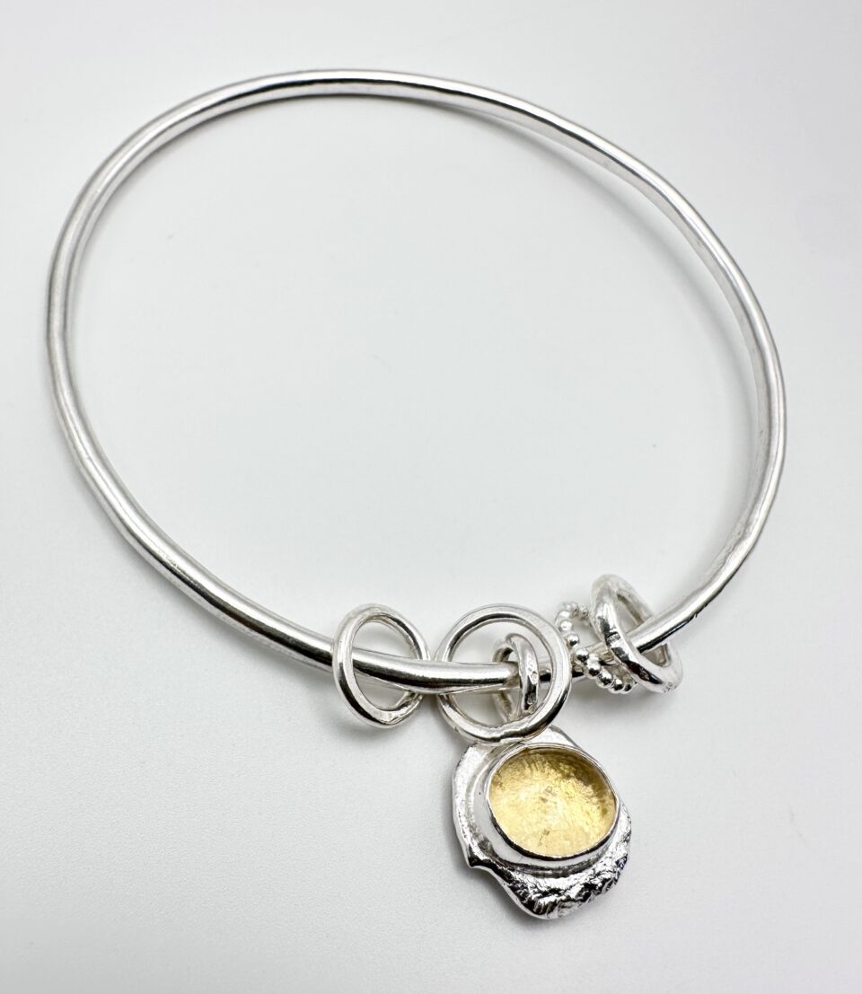 handmade sterling silver bangle with citrine charm and organic molten texture