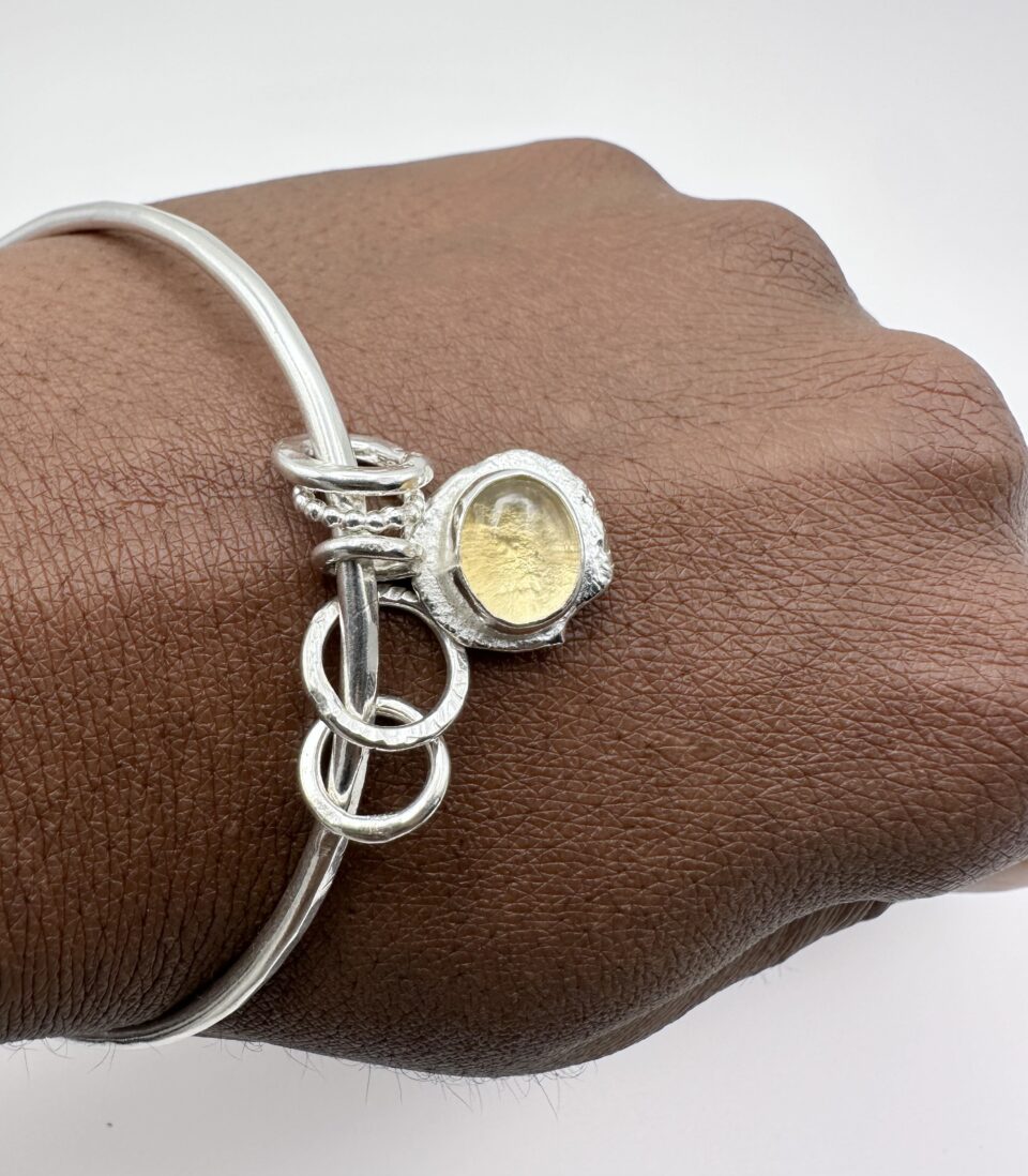 handmade sterling silver bangle with citrine charm and organic molten texture