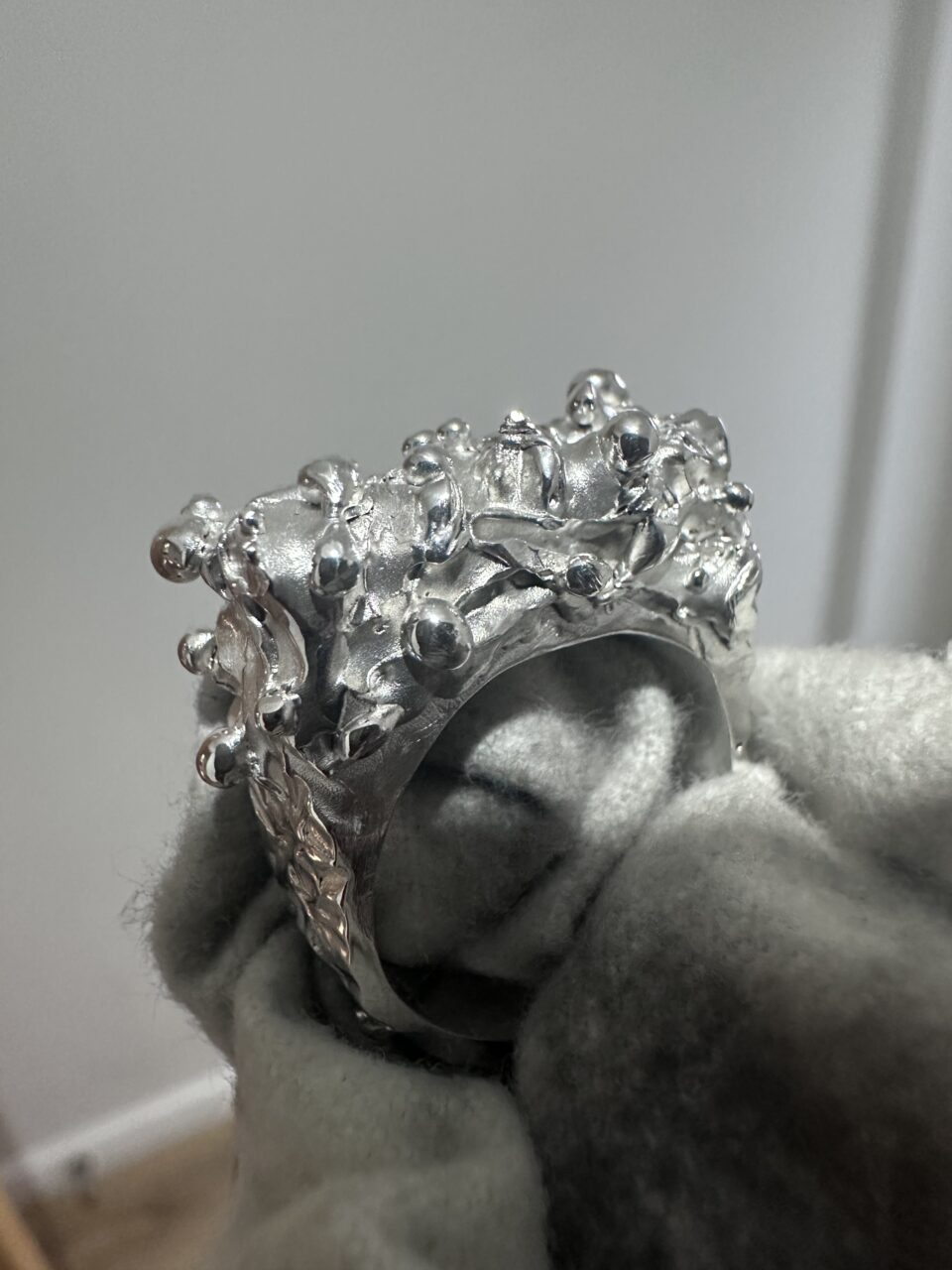 This picture is of a finished wax cast silver ring for the wax casting workshop
