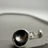 Bohdee tiny solid silver dimple stud earring with a textured recessed centre and polished rounded edge.