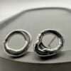 Bohdee small solid silver molten stud earrings with irregular open-circle shapes and softly textured surfaces.