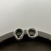 Bohdee small solid silver molten stud earrings with irregular open-circle shapes and softly textured surfaces.