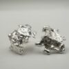 Bohdee recycled silver statement earrings with layered angular shapes, textured surfaces and irregular open centres