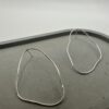 Bohdee large recycled silver organic stud earrings with flowing irregular outlines and a polished finish.